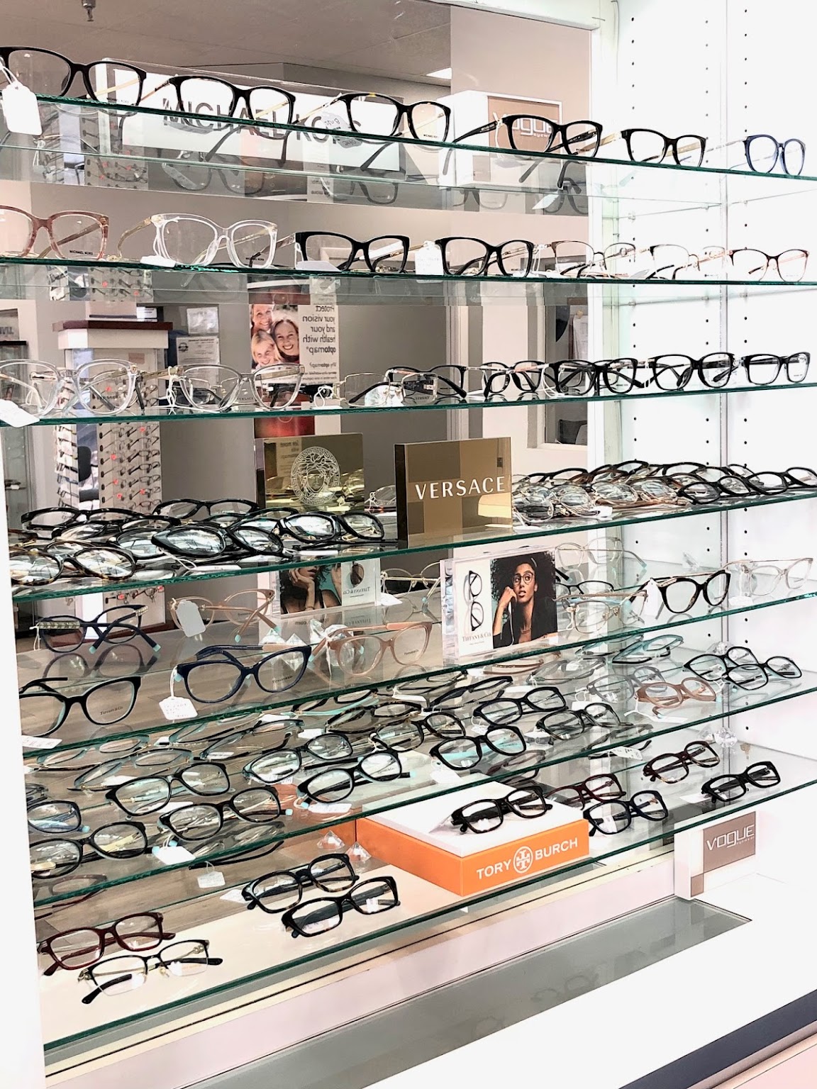 Designer frame wall — Versace, Tory Burch, Vogue